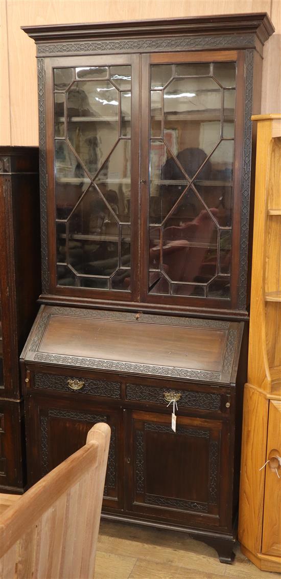 An Edwardian blind fret carved mahogany bureau bookcase W.102cm